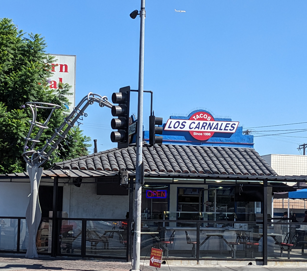 Taco Stand with a sax sculpture nearby
