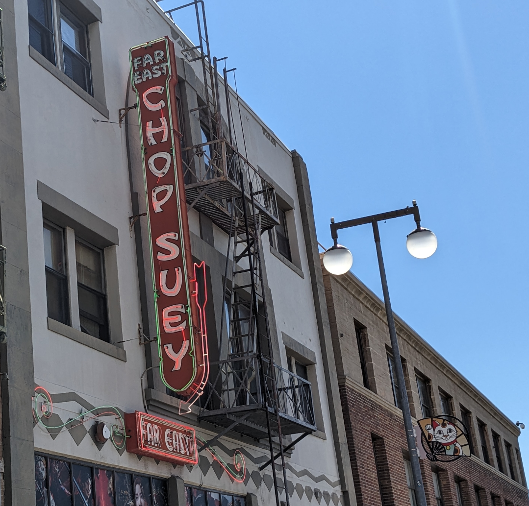 Classic Chop Suey sign. in the shade you can see the illuminated neon