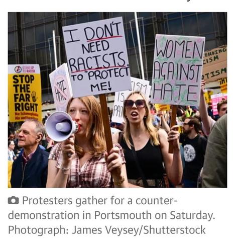 Women counter demonstrate against the fascist mob in Portsmouth. One placard reads 
"I don't need racists to protect me".
"I don't need racists to protect me".
