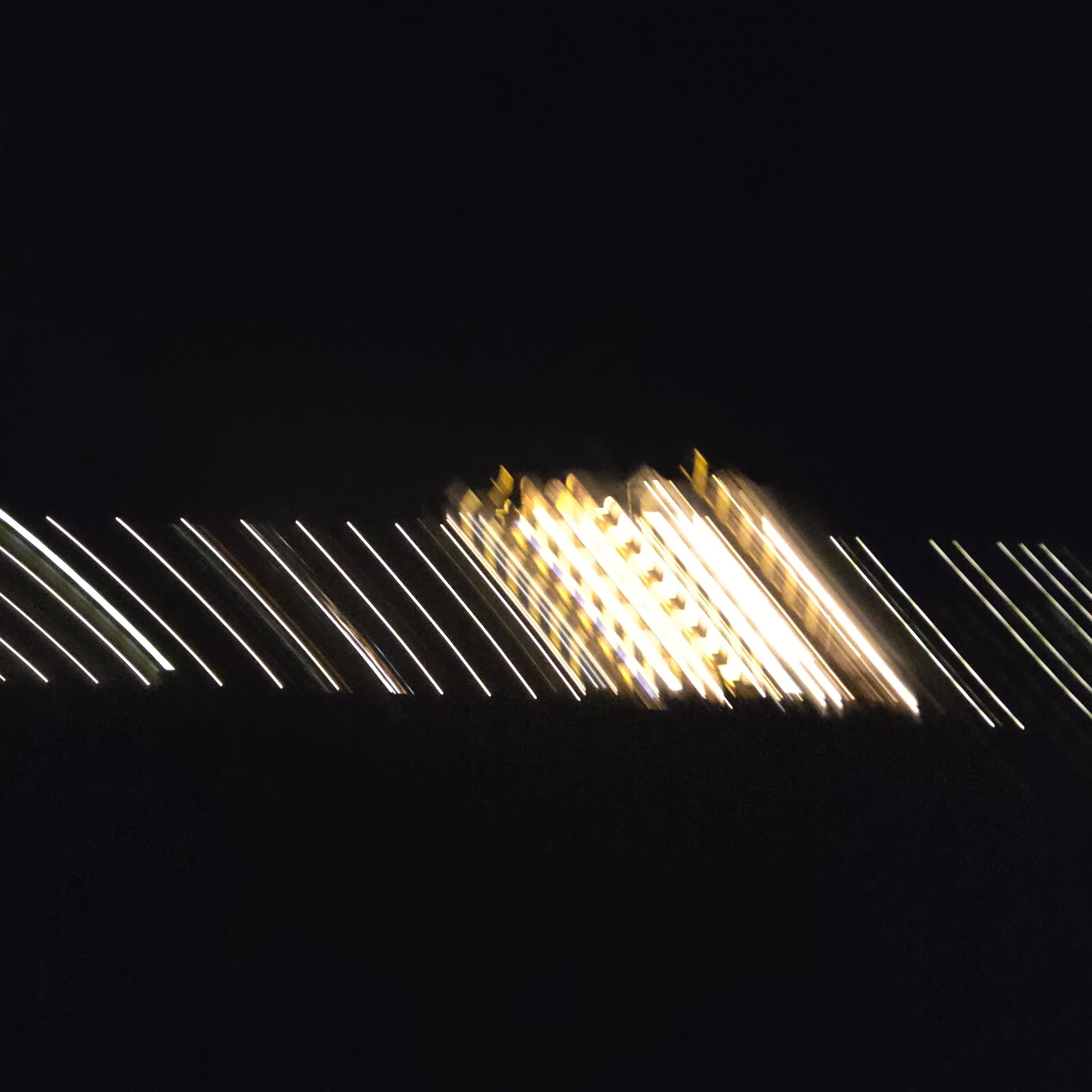 Lines of light, with a stronger spot just right of the center